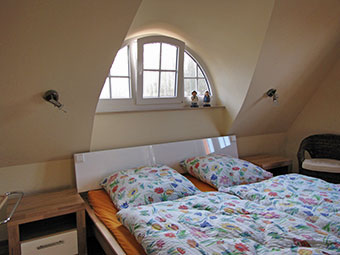 Ein Schlafzimmer im  Ferienhaus Sonneneck
